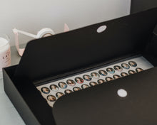 Load image into Gallery viewer, Simply Spaced archival media folder in black.